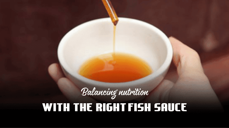 Fresh ingredients and fish sauce on a table, symbolizing balanced nutrition in Vietnamese cuisine